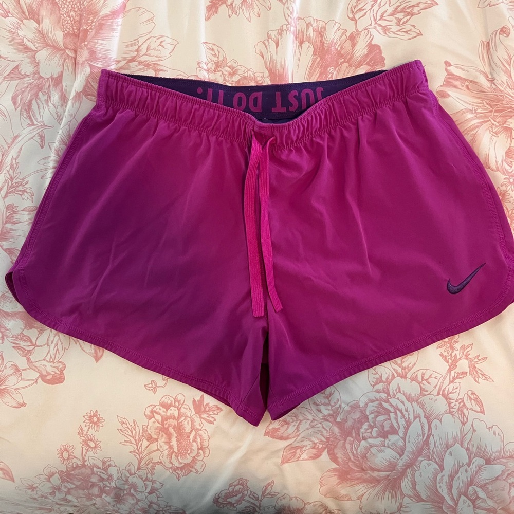Nike Medium shorts with built in shorts underneath and drawstring.